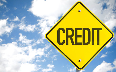 Credit sign with sky background