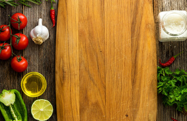 Vegetables on wooden background with empty copy space.

