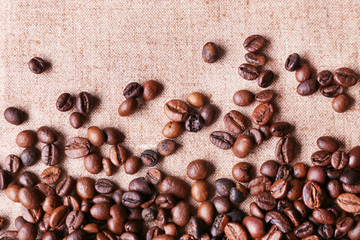Roasted coffee beans on the linen fabric