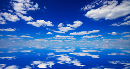 Fototapeta na wymiar sky and clouds reflected in water