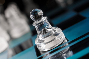 Transparent Pawn On Blue Chessboard With Crooked Angle