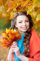 Naklejka na ściany i meble Autumn model, bright make up. woman on background fall landscape