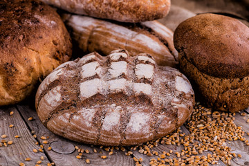 Fresh bread on wooden ground