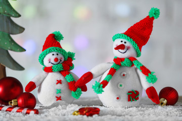 Cute snowmen on Christmas background