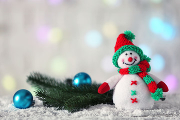 Fototapeta na wymiar Cute snowman on Christmas background