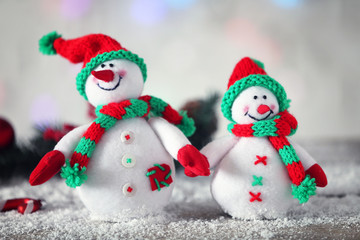 Cute snowmen on Christmas background
