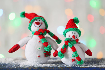 Cute snowmen on Christmas background