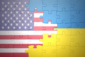 puzzle with the national flag of united states of america and ukraine