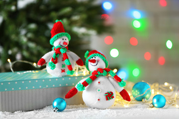 Cute snowmen on Christmas background