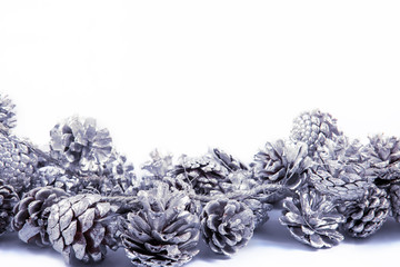Christmas background with pinecones decoration on white