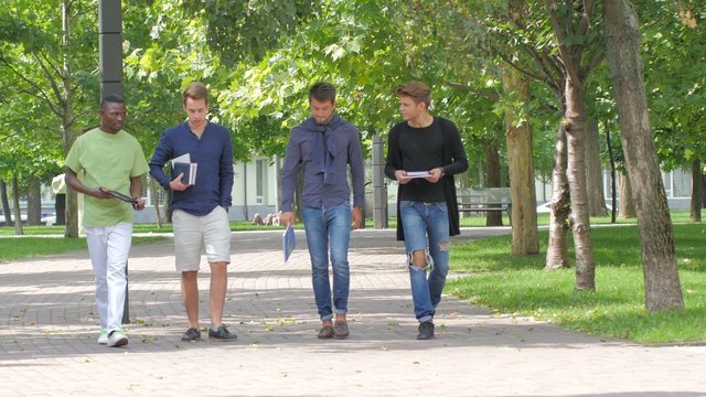 College students boy walking together on campus