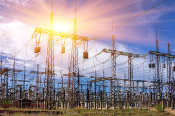 distribution electric substation with power lines, at sunset