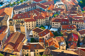 View of old town of Kotor on sunset. Red tiled roofs