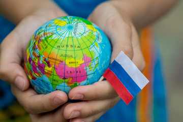 Globe in hand with the Russia flag 