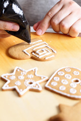 Decorating gingerbread cookies.