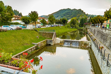 Fototapeta premium river through mountain village in Tuscany
