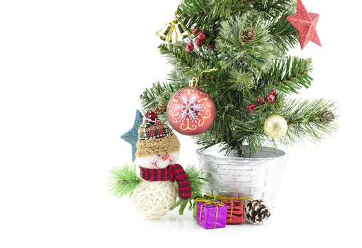 closeup and cropped  image of christmas tree  with santa claus , gift box, red ball,pinecone and golden ball isolated on white background