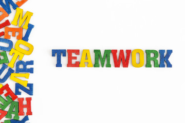 Series "Conceptual words": word "Teamwork" in wooden letters on white background
