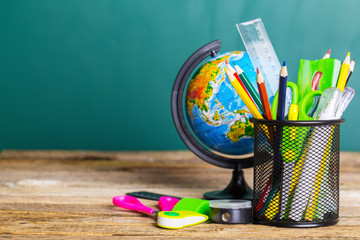 School supplies on the background of the school board © zadorozhna