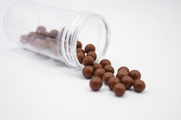 herbal medicine pills on white background