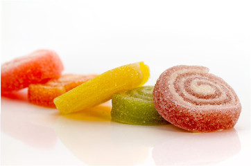 Colorful Gummy sweets spiral stacking focus isolated on white background