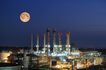 Obraz na płótnie Canvas Oil Refinery twilight with moon industrial.