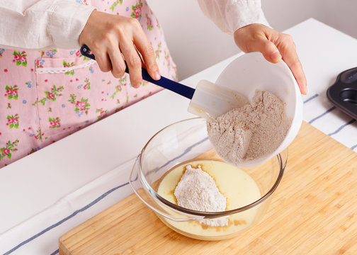 Woman Baking Healthy Muffin With Flour Mixed Ground Flaxseed