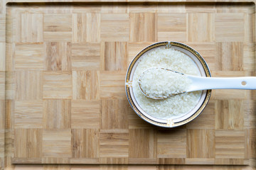 Organic white rice on the Asian spoon