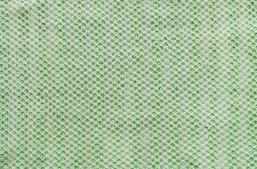 Closeup old and dirty green napkin fabric background