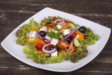 Fresh vegetable greek salad on the table