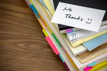 No Thanks; The Pile of Business Documents on the Desk