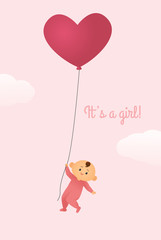Baby Girl Holding on to a Heart-Shaped Balloon