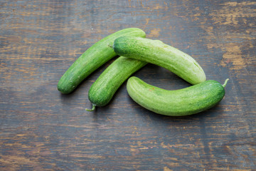 The cucumbers on a wood background
