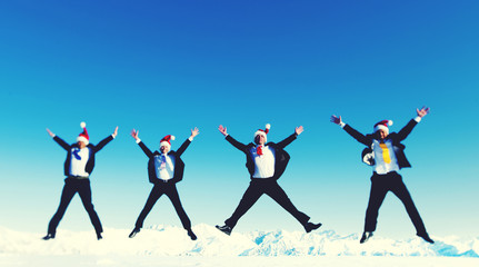Businessmen Celebrating Christmas on Snow Mountain Concept