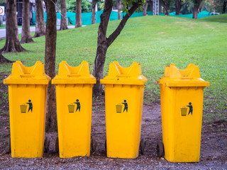 Yellow trashbins in the park