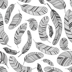 Seamless ethnic pattern with black and white feathers. Can be used to print on fabric, paper, wallpaper and other.