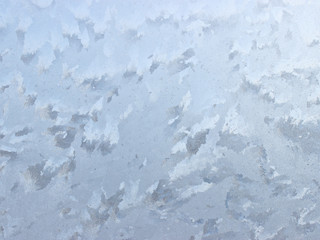 Frosty natural pattern on winter window.