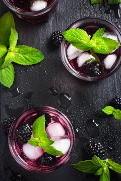 refreshing cocktail with blueberry, ice and mint,
