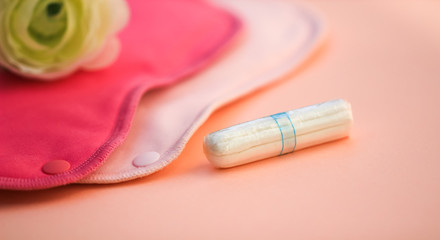 Obraz na płótnie Canvas Tampon and cloth menstrual pads
