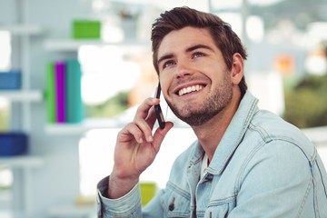 Creative businessman working on his smartphone