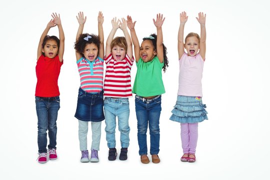 Small Group Of Kids Standing Together With Arms Raised