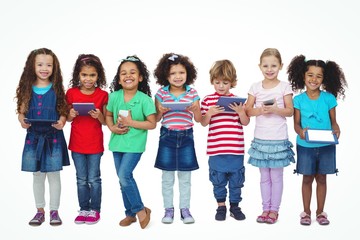 Kids standing together holding tablets and phones