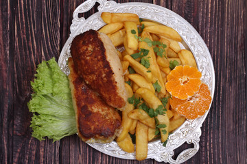 Chicken fillet in a crisp on salad leaves