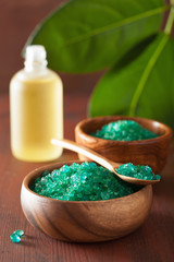 green herbal salt and essential oils for healthy spa bath