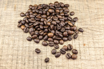 Coffee beans on wood background