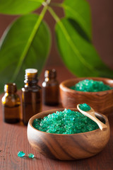 green herbal salt and essential oils for healthy spa bath