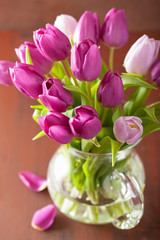 beautiful purple tulip flowers bouquet in vase © Olga Miltsova