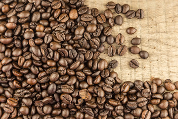 Coffee beans on wood background