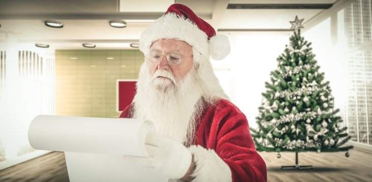 Composite image of santa claus checking his list