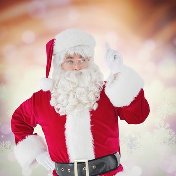 Composite image of serious santa claus pointing his finger